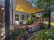 Outdoor patio area with pavers, comfortable wicker furniture and a lovely shade-providing pergola at 346 Cicadas Song, Moncks Corner, SC 29461