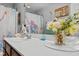 The bathroom vanity features a light countertop and nautical-themed decor at 346 Cicadas Song, Moncks Corner, SC 29461