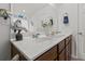 Bathroom vanity with a single sink, beach-themed decor, and a large mirror at 346 Cicadas Song, Moncks Corner, SC 29461