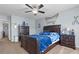 The bedroom features a dark wood bed frame, nautical decor and a ceiling fan at 346 Cicadas Song, Moncks Corner, SC 29461