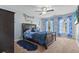 The cozy bedroom showcases nautical-themed decor, including a fun comforter and curtains at 346 Cicadas Song, Moncks Corner, SC 29461
