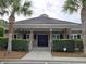 Beautiful clubhouse with palm trees, offering a stylish and relaxing community space at 346 Cicadas Song, Moncks Corner, SC 29461
