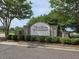 Landscaped Moss Grove Plantation entrance sign with lush greenery at 346 Cicadas Song, Moncks Corner, SC 29461
