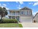 Charming two-story home with a double porch and a two car garage at 346 Cicadas Song, Moncks Corner, SC 29461