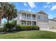 Charming two-story home with a double porch, manicured lawn, and palm tree at 346 Cicadas Song, Moncks Corner, SC 29461