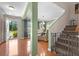 Inviting foyer with hardwood floors, stairway, view to dining area, and ample natural light at 346 Cicadas Song, Moncks Corner, SC 29461