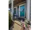 Charming front porch and door decorated with beautiful spring decor at 346 Cicadas Song, Moncks Corner, SC 29461