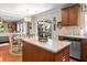 Open-concept kitchen with island, stainless steel appliances, and view to the backyard at 346 Cicadas Song, Moncks Corner, SC 29461