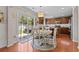 Eat-in kitchen showcasing wooden cabinets, stainless steel appliances, and a sliding glass door to the backyard at 346 Cicadas Song, Moncks Corner, SC 29461