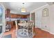 Eat-in kitchen showcasing wooden cabinets, stainless steel appliances, and a sliding glass door to the backyard at 346 Cicadas Song, Moncks Corner, SC 29461