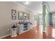 Open living area featuring hardwood floors, stylish decor, and an inviting entryway at 346 Cicadas Song, Moncks Corner, SC 29461