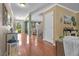 Bright living space featuring hardwood floors, an inviting foyer, and modern design elements at 346 Cicadas Song, Moncks Corner, SC 29461