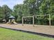 Community playground with swings, slide, and play equipment set in a wooded area at 346 Cicadas Song, Moncks Corner, SC 29461
