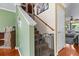 Staircase with carpeted steps, wood railing, baby gate, and decor at 346 Cicadas Song, Moncks Corner, SC 29461