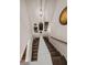 Stairway with carpeted steps and decorative wall art leading both up and down at 346 Cicadas Song, Moncks Corner, SC 29461