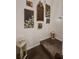 Ascending carpeted stairway with decorative wall art, lit by elegant lanterns at 346 Cicadas Song, Moncks Corner, SC 29461