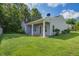 Backyard showcasing a covered patio, green lawn, and peaceful atmosphere for outdoor relaxation at 3639 Pimmit Pl, Ladson, SC 29456