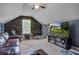 Attic bonus room with stone accent wall, carpeted floors, vaulted ceiling, and abundant natural light at 3639 Pimmit Pl, Ladson, SC 29456