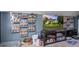 Attic bonus room setup with a TV, collectibles, and ample storage for all your entertainment needs at 3639 Pimmit Pl, Ladson, SC 29456