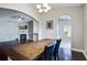 Elegant dining area seamlessly connected to the living room with a view of the fireplace at 3639 Pimmit Pl, Ladson, SC 29456
