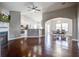 Open-concept living room flowing into the kitchen and dining area, complete with fireplace and hardwood floors at 3639 Pimmit Pl, Ladson, SC 29456