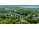 An aerial view of a neighborhood featuring lush greenery with an arrow pointing to the property at 3711 Tip Ln, Mount Pleasant, SC 29466