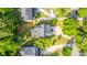 Overhead view of a house with a gray roof, driveway and tree-filled yard surrounded by neighborhood homes at 3711 Tip Ln, Mount Pleasant, SC 29466