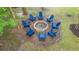 Aerial shot of fire pit with Adirondack chairs in wooded backyard at 3711 Tip Ln, Mount Pleasant, SC 29466