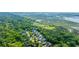 Stunning aerial view of a neighborhood surrounded by lush greenery and a beautiful marsh in the distance at 3711 Tip Ln, Mount Pleasant, SC 29466