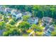 Aerial view of a neighborhood featuring sidewalks and lush greenery with multiple home styles at 3711 Tip Ln, Mount Pleasant, SC 29466