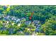 An aerial view of a neighborhood featuring lush greenery with an arrow pointing to the property at 3711 Tip Ln, Mount Pleasant, SC 29466