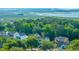 An aerial view of a neighborhood featuring lush greenery and a beautiful marsh in the distance at 3711 Tip Ln, Mount Pleasant, SC 29466