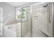 Beautiful bathroom showcasing the tub and glass shower with tile surround and built-in seat at 3711 Tip Ln, Mount Pleasant, SC 29466