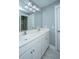 Bright bathroom with a double vanity, large mirror and white cabinets at 3711 Tip Ln, Mount Pleasant, SC 29466