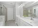 This primary bathroom offers a dual sink vanity, walk-in shower, and soaking tub at 3711 Tip Ln, Mount Pleasant, SC 29466