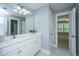 Bathroom featuring double sinks, a large mirror and access to another room at 3711 Tip Ln, Mount Pleasant, SC 29466