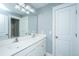 Well-lit bathroom features double sinks and a large mirror at 3711 Tip Ln, Mount Pleasant, SC 29466