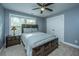 Cozy bedroom features a queen size bed, ceiling fan and a bedside table at 3711 Tip Ln, Mount Pleasant, SC 29466