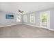 Bright bedroom featuring neutral colors, carpet, and a door to the outside balcony at 3711 Tip Ln, Mount Pleasant, SC 29466
