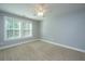 Empty bedroom with large windows, neutral walls and carpet flooring at 3711 Tip Ln, Mount Pleasant, SC 29466