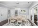 Bright dining room with crown molding, designer rug, and access to the outdoor living space at 3711 Tip Ln, Mount Pleasant, SC 29466