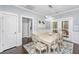 Dining room featuring a modern chandelier, neutral walls, and a view to the patio at 3711 Tip Ln, Mount Pleasant, SC 29466