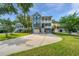 Charming home with a double porch, large driveway, garage, and well-manicured lawn at 3711 Tip Ln, Mount Pleasant, SC 29466
