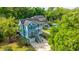 Beautiful exterior shot features a two-story home with classic design, lush landscaping, and a private driveway at 3711 Tip Ln, Mount Pleasant, SC 29466