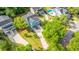 Up-close aerial view of the home's exterior, long driveway, and well manicured lawn at 3711 Tip Ln, Mount Pleasant, SC 29466