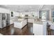 Spacious kitchen featuring white cabinetry, stainless appliances, granite countertops, and a center island at 3711 Tip Ln, Mount Pleasant, SC 29466