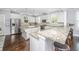Gourmet kitchen boasts granite counters, a center island, stainless appliances, and dark wood flooring at 3711 Tip Ln, Mount Pleasant, SC 29466