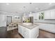 Bright kitchen with a large island, white cabinets, granite countertops, and stainless appliances at 3711 Tip Ln, Mount Pleasant, SC 29466