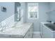 Well-lit laundry area with granite counter and Whirlpool washer/dryer at 3711 Tip Ln, Mount Pleasant, SC 29466