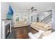 Inviting living room with hardwood floors, fireplace, and large windows with natural light at 3711 Tip Ln, Mount Pleasant, SC 29466